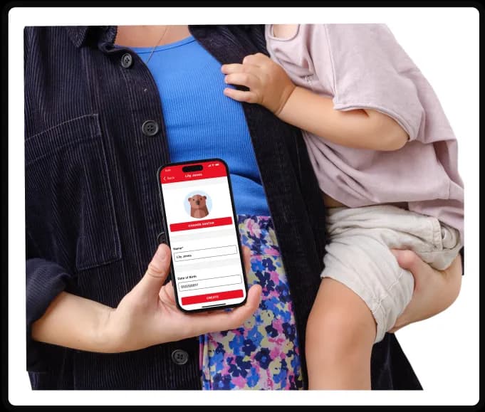 Women holding a child showing child care app on a phone