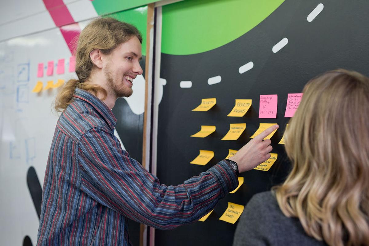 A wall in our Bournemouth office covered in post-it notes during a meeting.