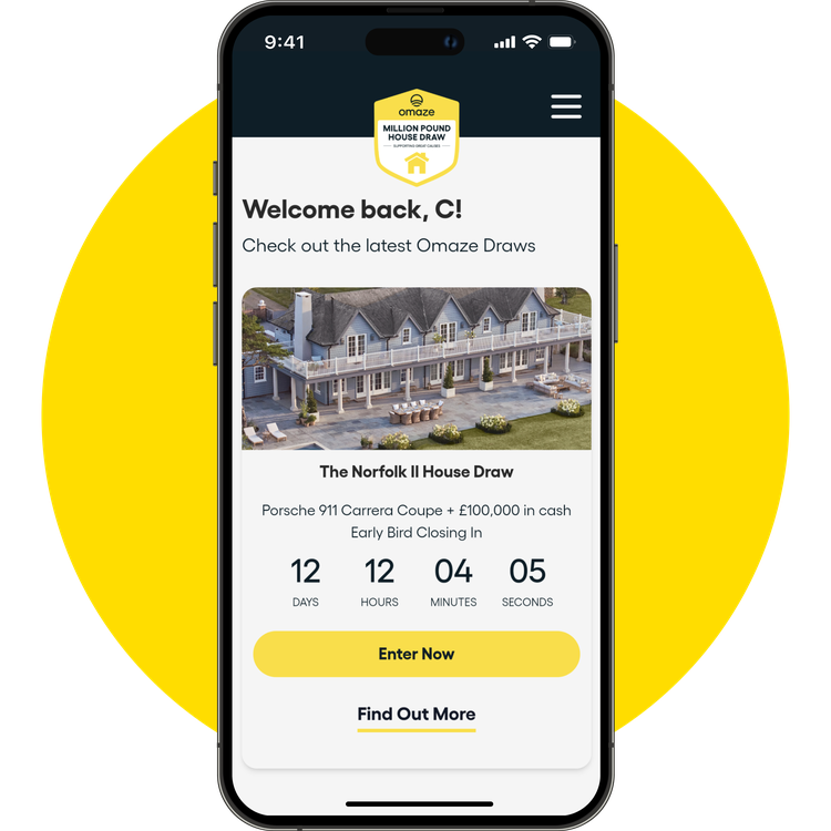 IPhone on a yellow circle. The screen shows a prize draw on the Omaze app for a big house in Norfolk. There is a countdown and a button to enter.