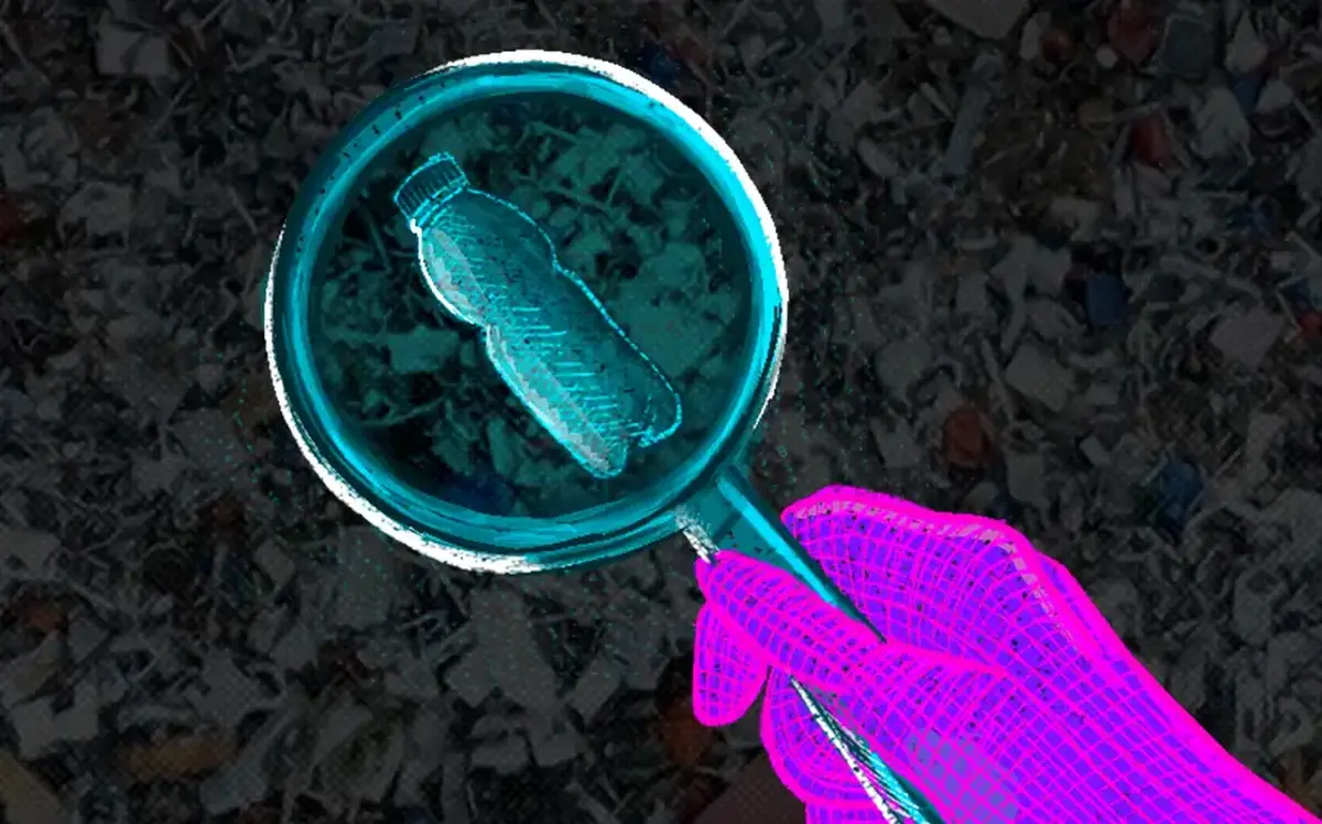 A magnifying glass looking through waste.